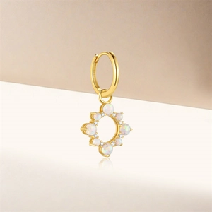 Detailed macro view of S925 silver gold earring with opal sun and moon pendants