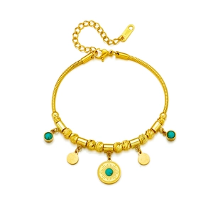 Golden stainless steel beaded bracelet featuring turquoise charms and round rippled pendants