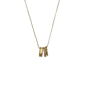 Elegant gold necklace with triple rings featuring mother of pearl and pavé crystals