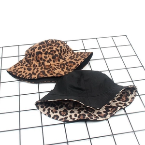 Women leopard print reversible faux suede bucket hat in black and animal pattern