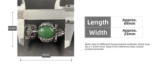 Detailed measurement showing owl brooch dimensions 69mm x 23mm with green crystal inlay