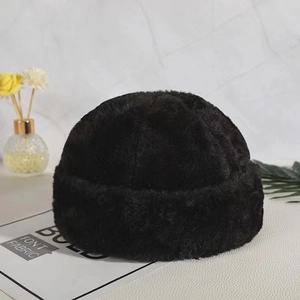 Detailed plush texture of thick black faux fur dockers cap on a stylish marble background
