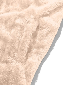 Macro detail of soft apricot plush arctic fleece fabric with premium fuzzy texture