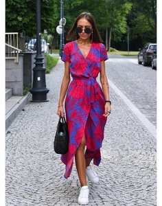 Close-up of a floral V-neck midi dress with a waist tie and irregular slit hem for summer
