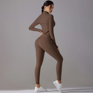 Detailed back view of high-waisted seamless brown yoga leggings and long sleeve sports top