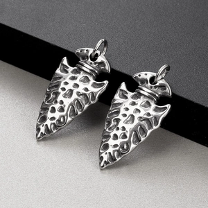 Vintage Viking spearhead pendants with hammered silver texture and nordic rune details