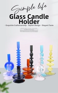 Macro detail of various colorful glass candle holders with elegant geometric designs