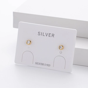 Detail of round cubic zirconia stud earrings with S925 sterling silver hallmarked card