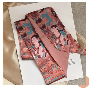 Detail of a vintage Dunhuang silk scarf with traditional mural character painting on fabric