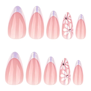 Almond shaped press-on nails in nude pink with purple holographic French tips and floral art