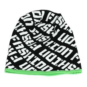 Detailed view of black knitted beanie with fluorescent green edge and white letter prints
