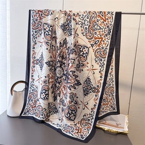 Elegant paisley print silk satin shawl featuring navy blue and caramel mandala design