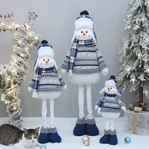 Three telescopic Christmas snowman plush dolls in blue and white on decorative snow