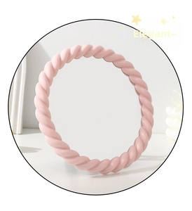 Close-up of pink twisted rope frame design on this round adjustable desktop makeup mirror