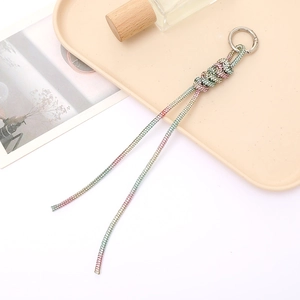 Close-up of a 4mm gradient rhinestone knotted keychain with a silver metal clasp