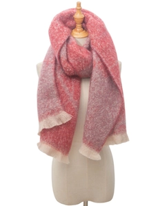 Detail of thick boucle scarf with pink jacquard flower patterns and fringed edges