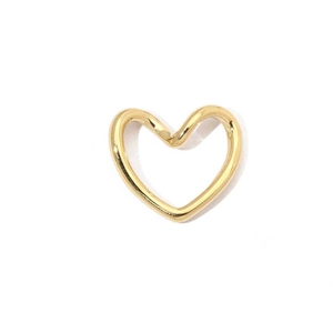 Detail of a minimalist gold hollow heart-shaped charm pendant in polished stainless steel