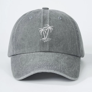 Detailed view of washed grey cotton baseball cap with white palm tree embroidery