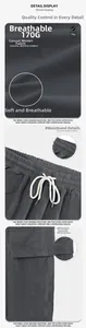 Detail of grey cargo shorts showing elastic drawstring waist and woven fabric texture