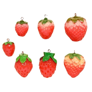 Set of seven realistic 3D resin strawberry pendants with metal loops on white background