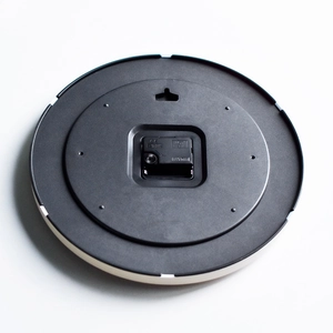 Modern 12-inch wall clock back view with silent quartz movement and CE certification mark