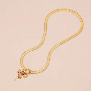Detail of gold snake chain necklace with red rose heart charms and butterfly pendants