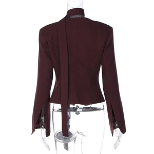 Detail view of burgundy blazer back with long ribbon decoration and split cuffs