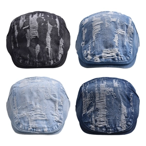 Distressed denim flat caps in four washes featuring ripped details and street style design
