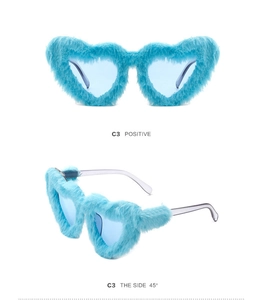 Detail of blue heart-shaped plush sunglasses showing front and 45-degree side views