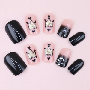 Short black and pink press-on nails with crown prints and glitter gradient design