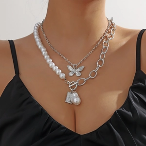 Baroque pearl layered necklace with silver butterfly pendant and toggle clasp closure