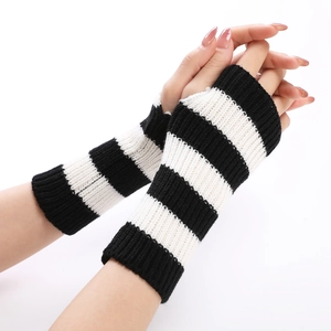 Close-up of black and white striped knitted arm warmers with a fingerless design