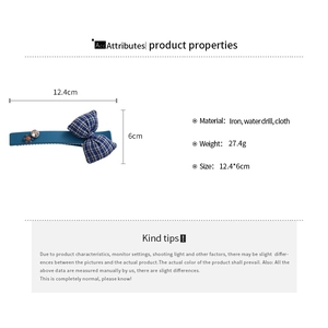 Detail view showing blue fabric bow hair clip with rhinestones and size dimensions