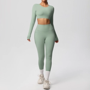 Sage green yoga set detail showing high waist leggings with side pockets and cropped top