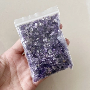 Macro shot of natural purple amethyst crystal chips in a clear resealable small bag