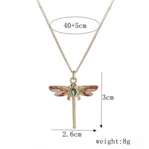 Gold-plated dragonfly pendant necklace with colorful enamel wings and green central stone