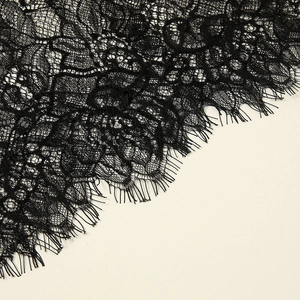 Elegant black lace bridal veil with intricate floral embroidery and eyelash fringe details