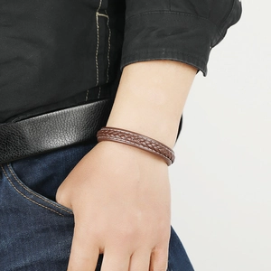 Braided brown leather bracelet for men and women featuring a secure magnetic clasp