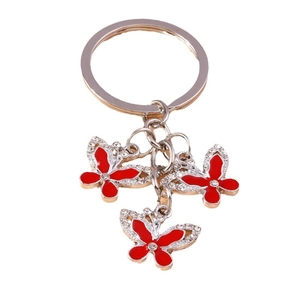 Three red butterfly pendants keychain with sparkling rhinestones and silver metal finish