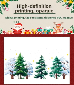 Detail of PVC Christmas window stickers showing snow-covered pine trees and reindeer
