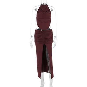 Detail of burgundy backless halter top and high slit skirt with pleated texture