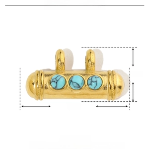 Detailed macro view of vintage gold stainless steel pendant with turquoise stones