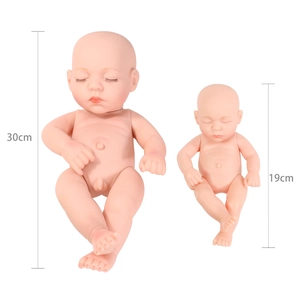 Size comparison of 30cm and 19cm soft vinyl reborn baby dolls in sleeping pose
