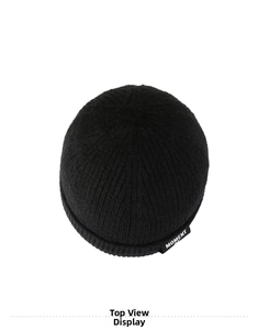 Top-down view of black ribbed knit beanie featuring white 'MOMENT' woven logo label