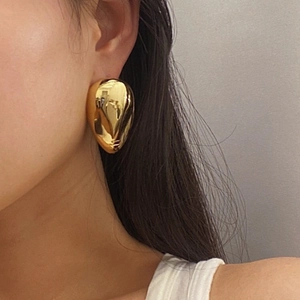 Polished 18k gold irregular water drop earrings with an artistic lava face texture