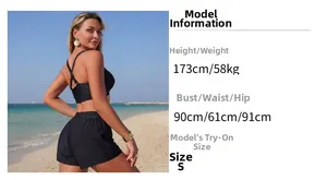 Detail of black sporty bikini set with crisscross back top and shorts on 173cm model