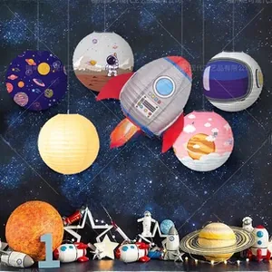 Space-themed paper lanterns featuring astronaut, rocket, and planets for party decoration