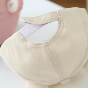 Detail of adjustable velcro strap and stitching on baby bear baseball cap