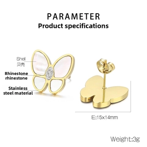 Detail view of gold butterfly earrings with shell inlay and tiny rhinestones