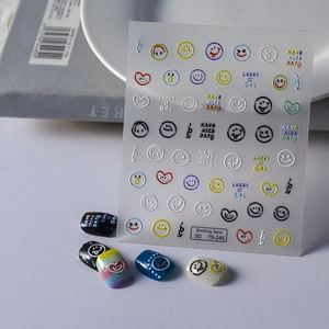Detailed 5D embossed nail stickers featuring smiling faces and hearts on varied nail colors